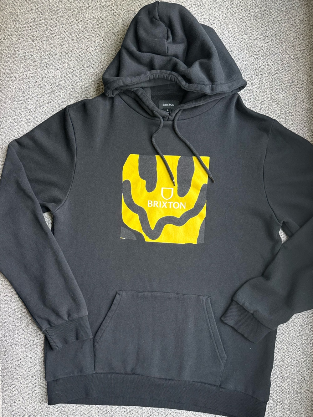 Brixton Men's Black Hoodie with Yellow Smile Graphic